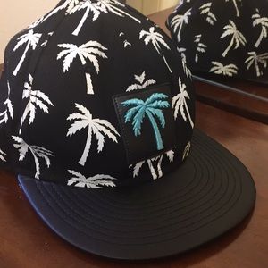black hat white palm trees all over